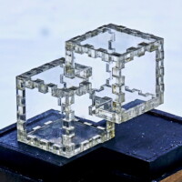 A 12-piece clear lucite Relativity Box