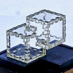 A 12-piece clear lucite Relativity Box