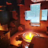 The inside of a 108-piece wooden sphere box.