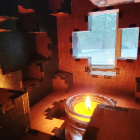 The inside of a 108-piece wooden sphere box.