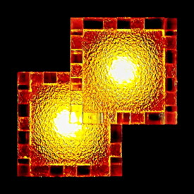 A 2D view of a frosted lucite Relativity box with LED tealights inside.