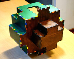 The bottom of a Christmas Tree Box sitting on it's side to show the 14-piece trunk.