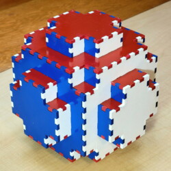 A 108-piece Sphere Box painted red, white, and blue