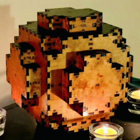 A 108-sided wooden box that approximates the shape of a sphere, with labels on the outside to demonstrate the software and assembly.