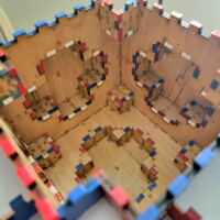 The inside of a 108-piece painted Sphere Box with one side removed.